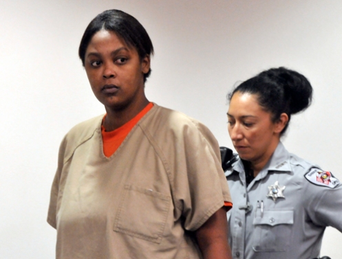 Antoinette Davis is escorted into court during a hearing  in  October 2010; she will not face the death penalty for prostituting  her daughter Shaniya Davis to Mario Andrette McNeill  (Courtesy: SpillDaBeanz.com)