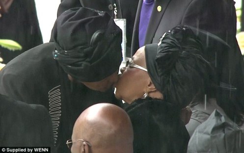 They may have been divorced, they may have been political rivals, but Nelson and Winnie Mandela still had a bond with her former husband, a bond reflected with this kiss between Winnie and  Graca Machel, his widow.  Some have called them Nelson's co-wives, and perhaps they were (Courtesy: